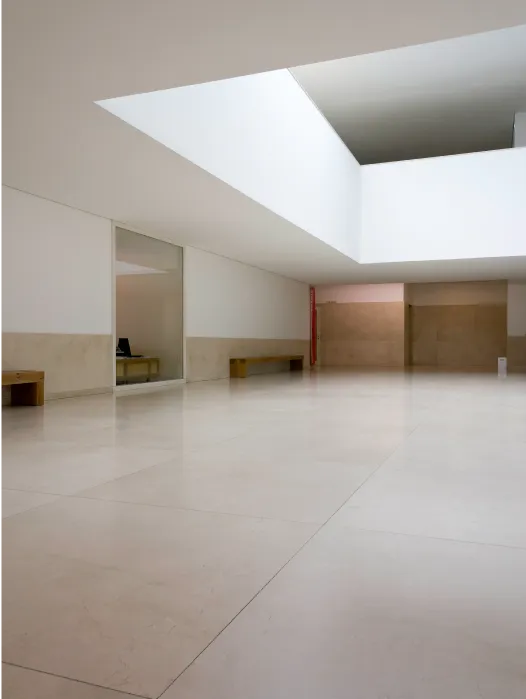 A large room with a skylight.