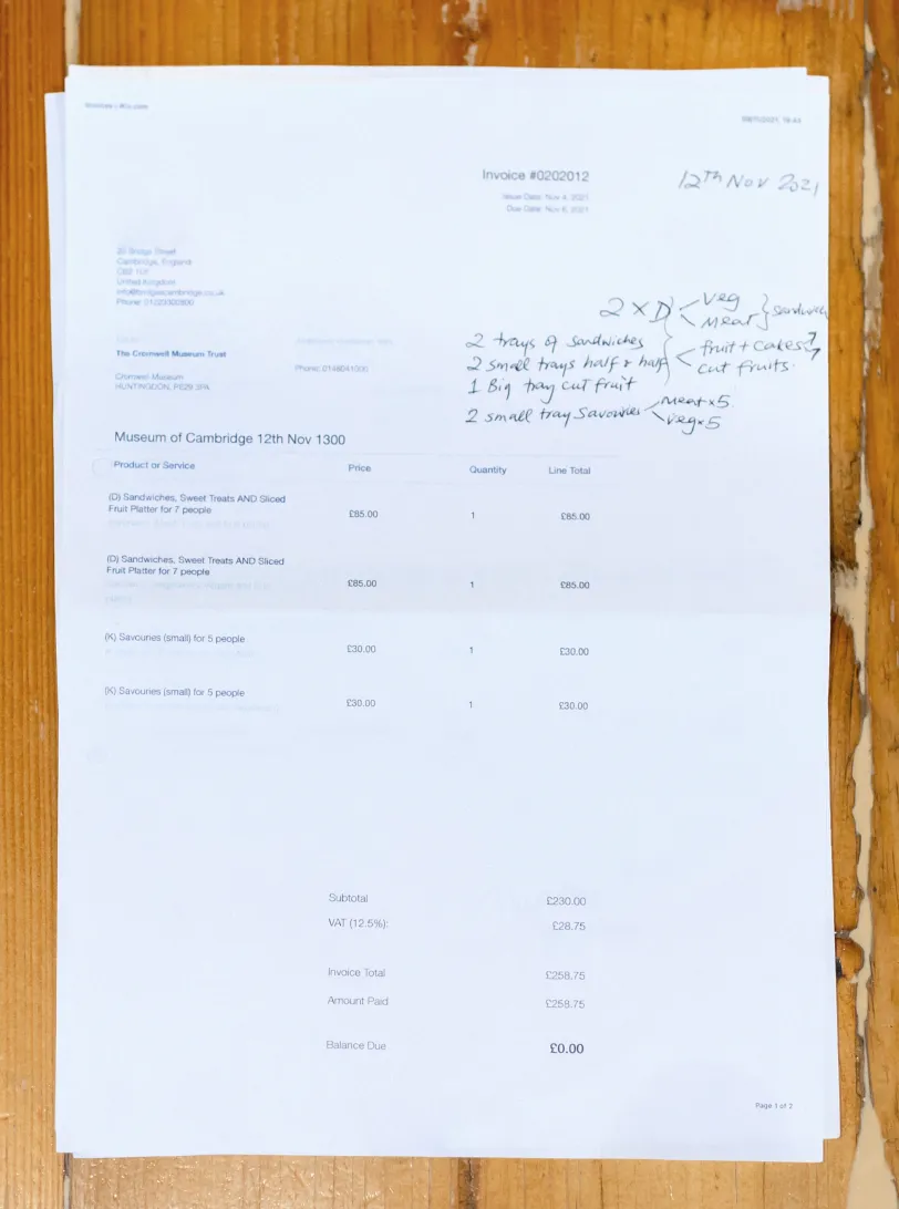 An invoice with hand written notes on it.