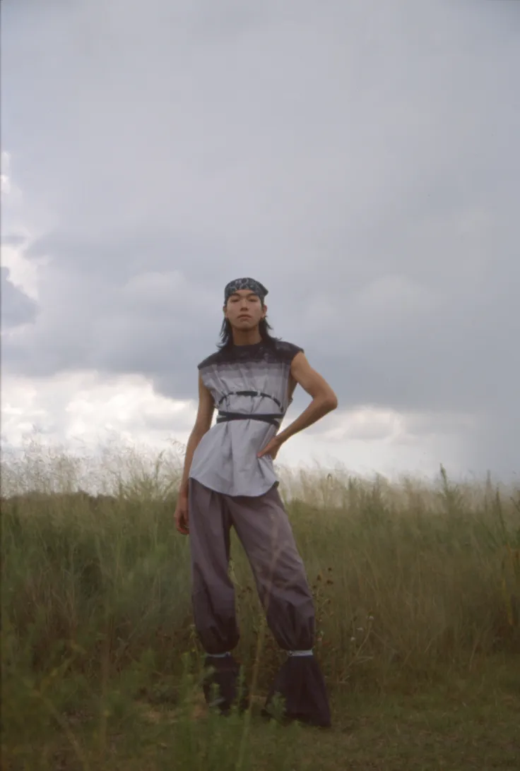 Artistic portrait of a person in a field.