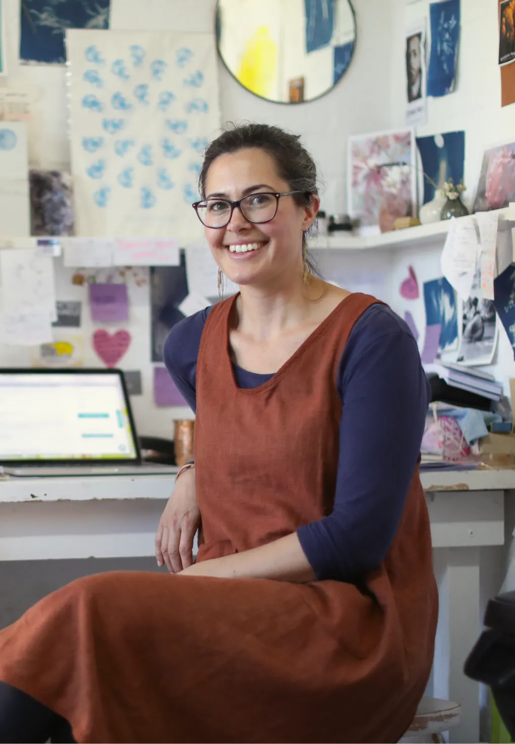 A portrait of a woman in an interior design office.
