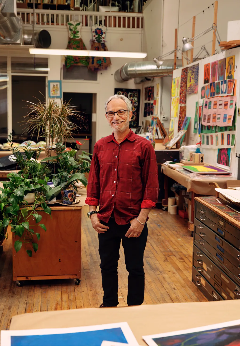 A portrait of an artist in their studio.