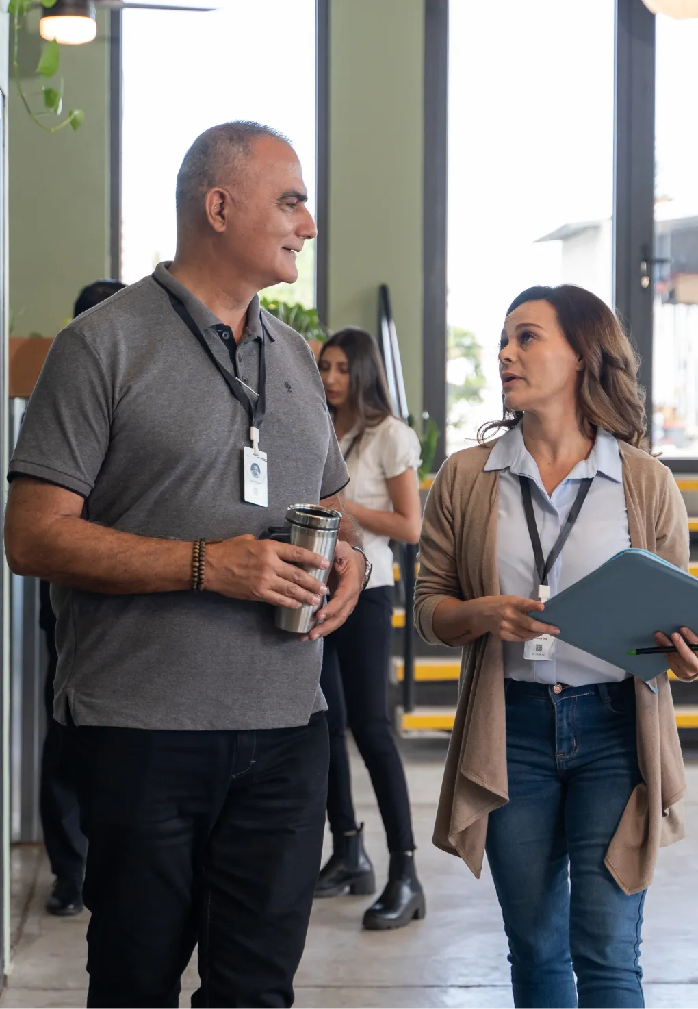 A man and woman standing at a conference.