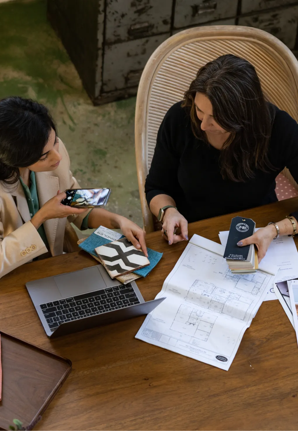 Two people working together on an interior design project.