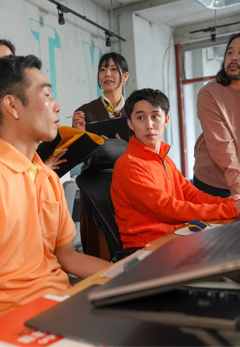 A man attentively listening to a team member.